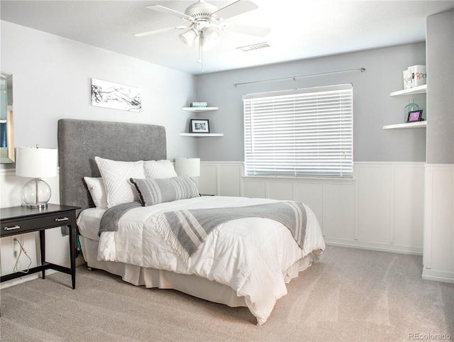 bedroom with light colored carpet and ceiling fan