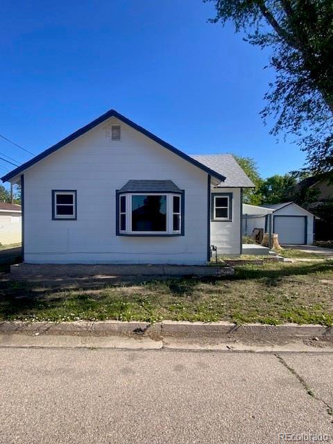 521 10th St, Fort Lupton, CO 80621 - view of side of property featuring an outdoor structure