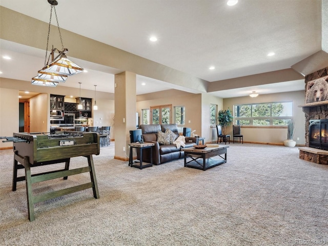 living area with recessed lighting, baseboards, carpet floors, and a fireplace