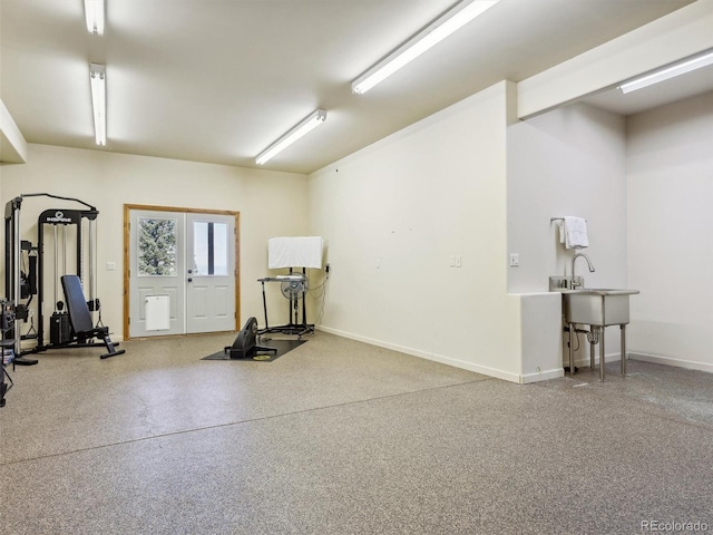 interior space with french doors and baseboards