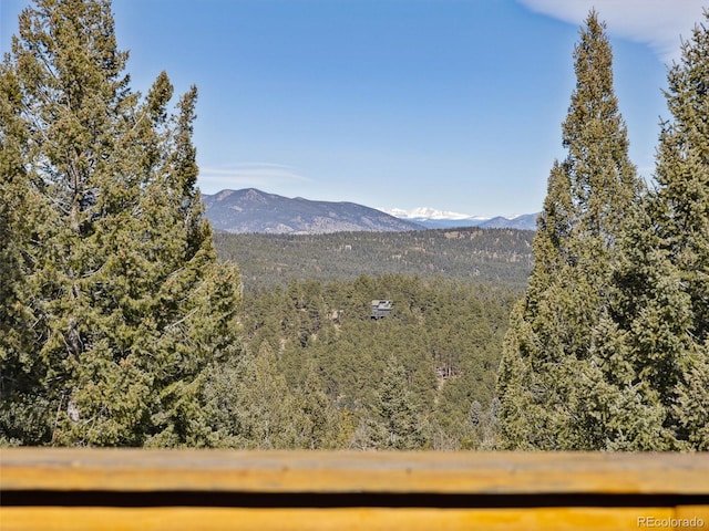 property view of mountains featuring a wooded view