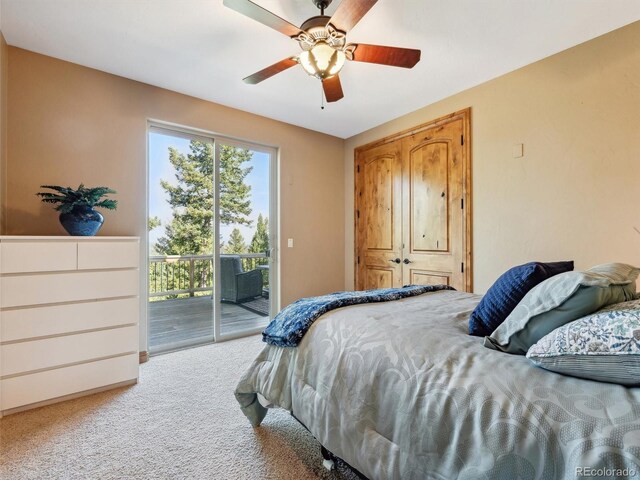 bedroom with access to exterior, carpet flooring, and a ceiling fan