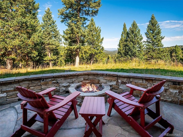 view of patio / terrace featuring a fire pit