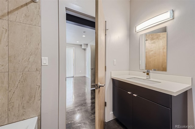 bathroom featuring vanity and concrete floors