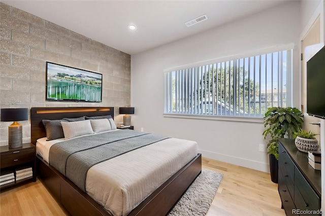 bedroom with light hardwood / wood-style flooring