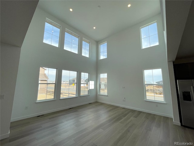 unfurnished living room with light wood-type flooring