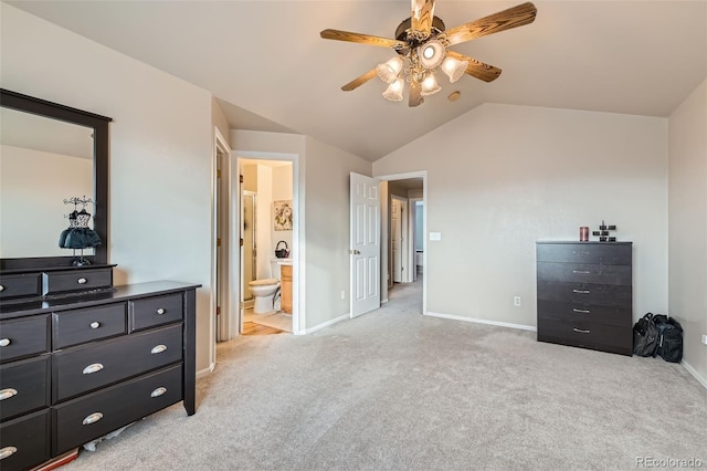 carpeted bedroom with lofted ceiling, ensuite bath, and ceiling fan