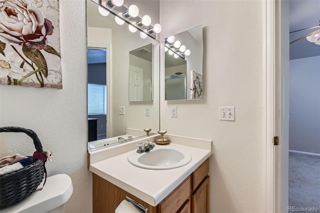 bathroom with toilet and vanity