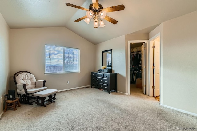 living area featuring ceiling fan, vaulted ceiling, and light colored carpet