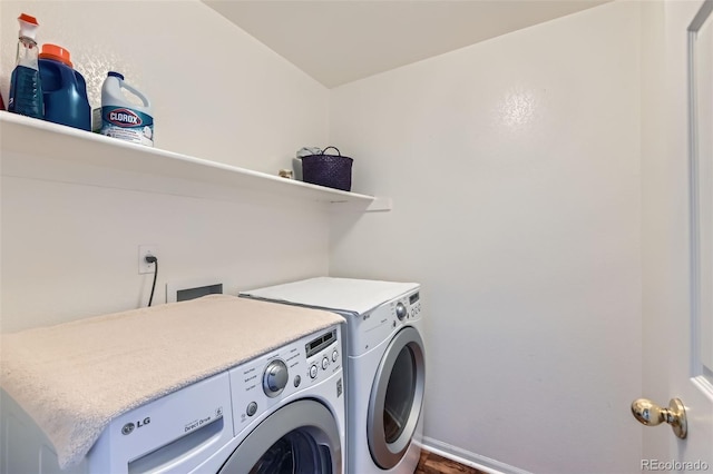 clothes washing area featuring washer and clothes dryer