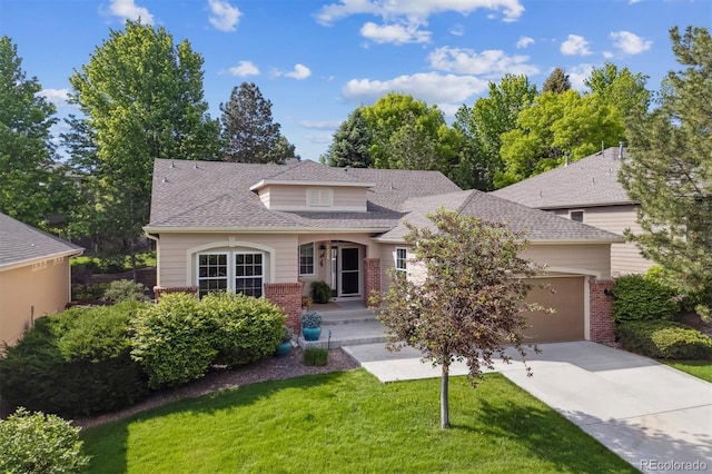 1026 Deer Clover Way, Castle Pines, CO 80108 - view of front facade with concrete driveway, a garage, brick siding, a front yard, and roof with shingles