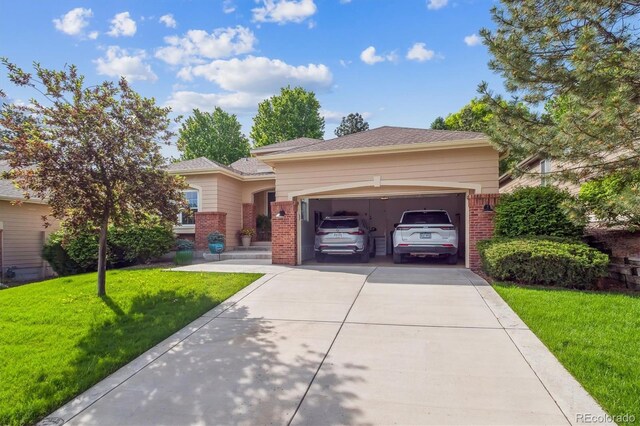 1026 Deer Clover Way, Castle Pines, CO 80108 - view of front facade featuring brick siding, concrete driveway, a garage, and a front yard