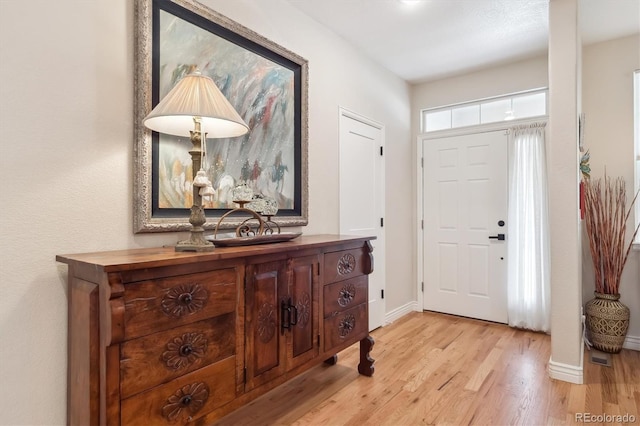 1026 Deer Clover Way, Castle Pines, CO 80108 - entryway featuring light wood-type flooring and baseboards