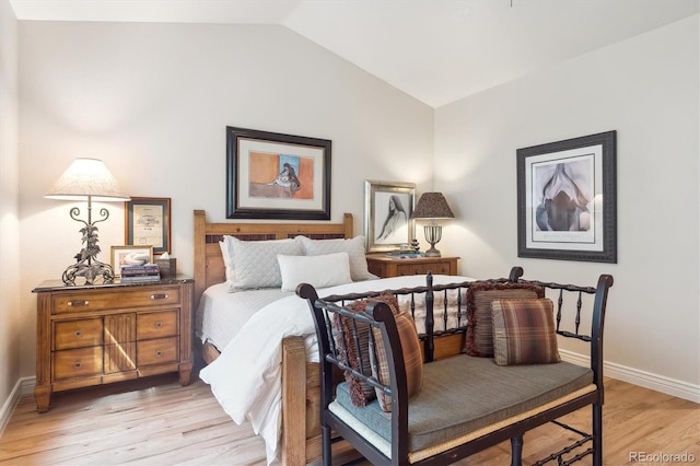 1026 Deer Clover Way, Castle Pines, CO 80108 - bedroom featuring lofted ceiling, light wood finished floors, and baseboards