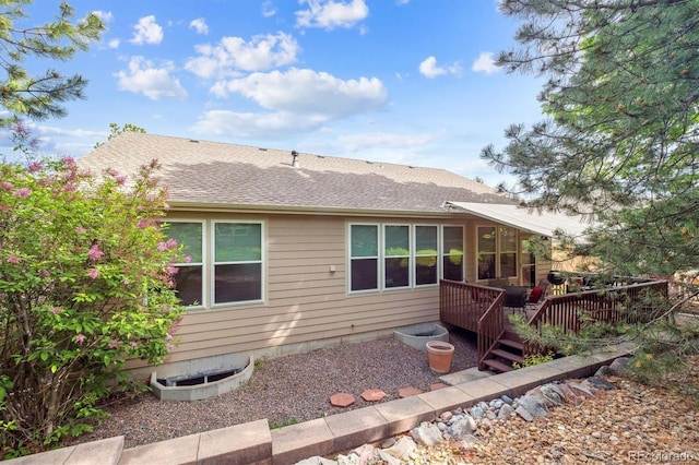 1026 Deer Clover Way, Castle Pines, CO 80108 - back of house with roof with shingles and a deck