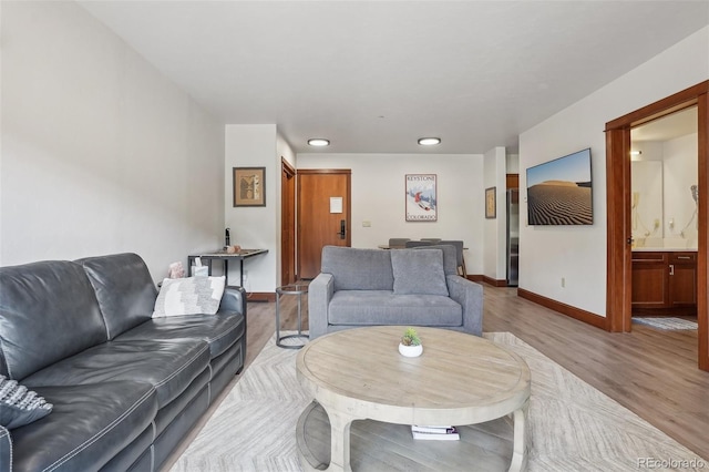 22787 US Highway 6 Unit 302, Keystone, CO 80435 - living area featuring baseboards and wood finished floors