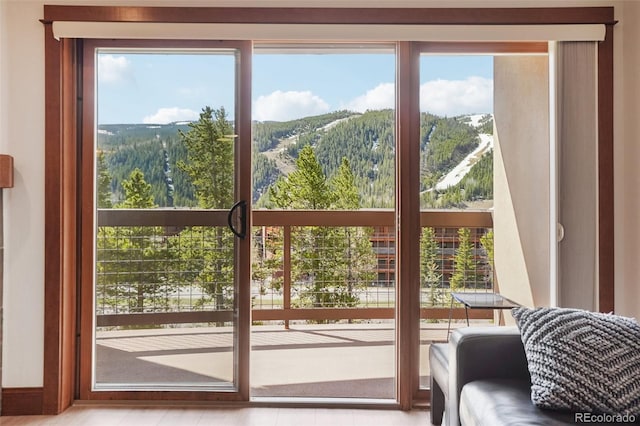22787 US Highway 6 Unit 302, Keystone, CO 80435 - doorway to outside with a mountain view and plenty of natural light