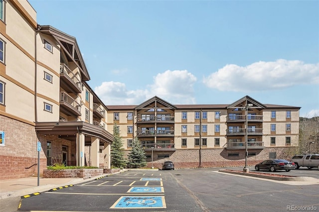 22787 US Highway 6 Unit 302, Keystone, CO 80435 - view of apartment building / complex featuring uncovered parking