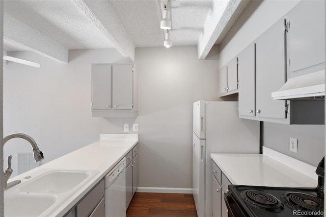 kitchen featuring black electric range, light countertops, dishwasher, and under cabinet range hood