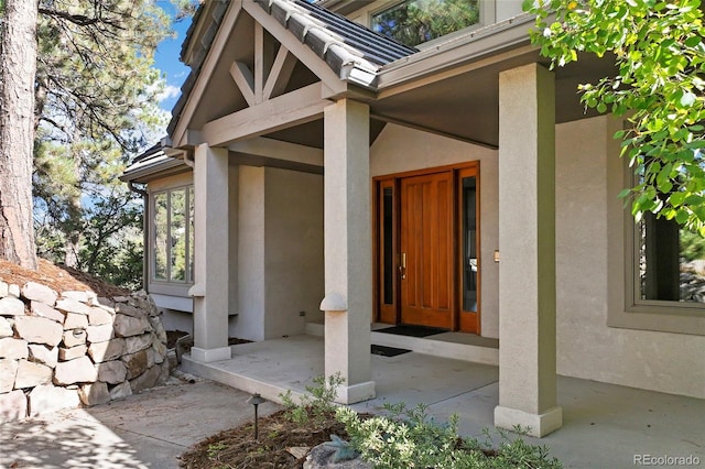 doorway to property with a porch