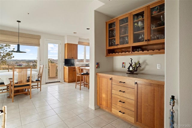 kitchen featuring pendant lighting and light tile patterned floors