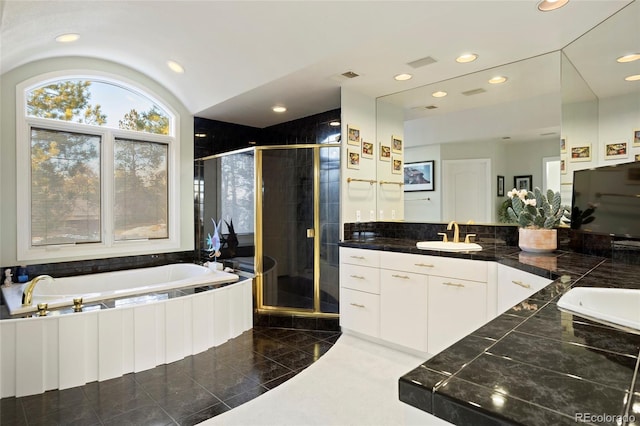 bathroom with shower with separate bathtub and vanity