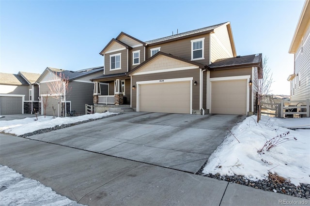 view of front of property with a garage and covered porch