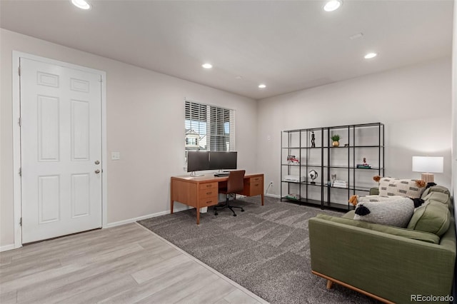 home office with hardwood / wood-style floors