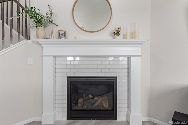 room details featuring a tiled fireplace