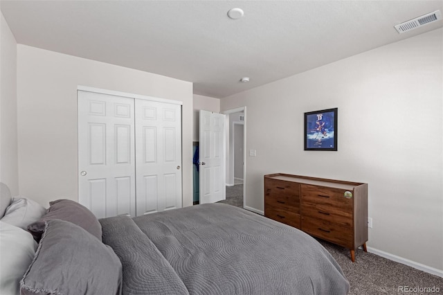 bedroom featuring a closet and carpet flooring