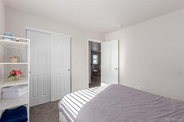 carpeted bedroom with a closet