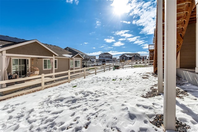 view of yard layered in snow