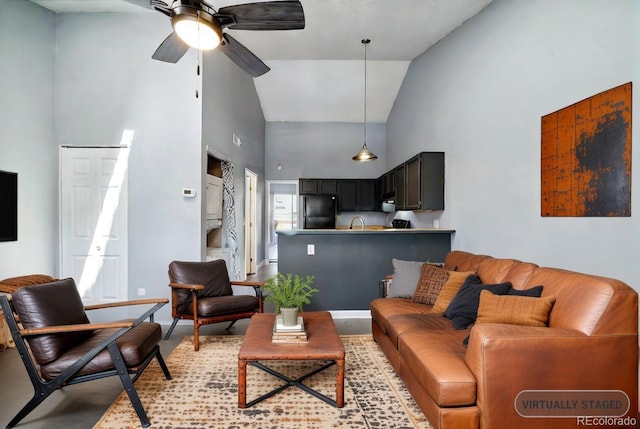 living room with high vaulted ceiling, ceiling fan, and sink