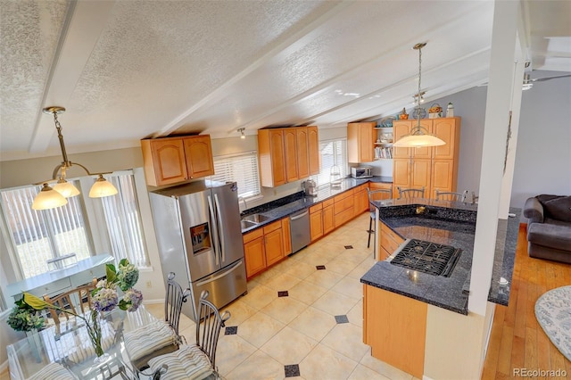 kitchen featuring pendant lighting, open shelves, a textured ceiling, stainless steel appliances, and vaulted ceiling