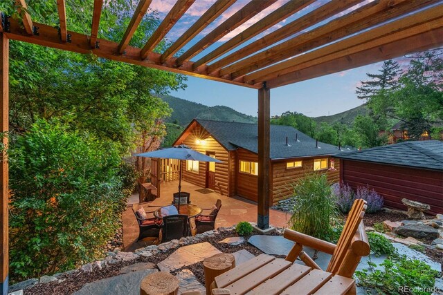 2874 SE Grapevine Rd, Idledale, CO 80453 - view of patio with a mountain view and a pergola