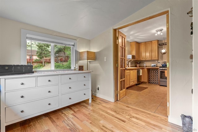 2874 SE Grapevine Rd, Idledale, CO 80453 - kitchen featuring stainless steel appliances, light countertops, and light wood-style floors