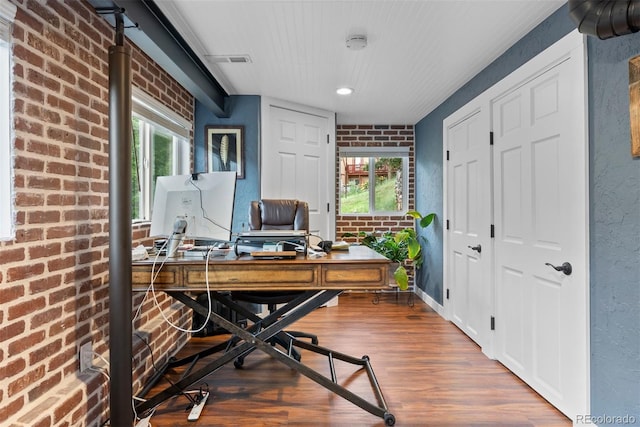 2874 SE Grapevine Rd, Idledale, CO 80453 - home office featuring wood finished floors, brick wall, and recessed lighting