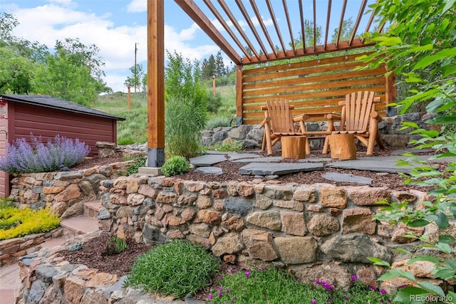 2874 SE Grapevine Rd, Idledale, CO 80453 - view of patio / terrace with a pergola