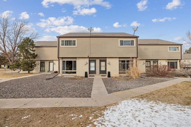 view of front of property featuring brick siding