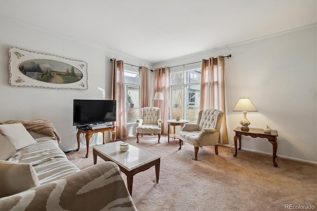 living room featuring crown molding, baseboards, and light colored carpet