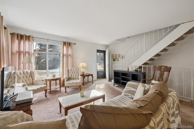 living room with light colored carpet and stairway