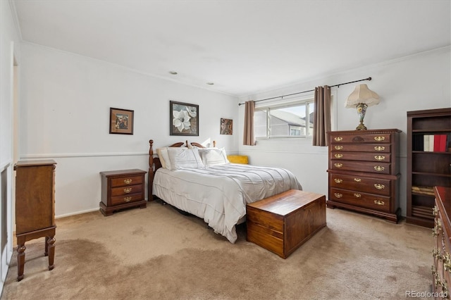 bedroom with light carpet and crown molding