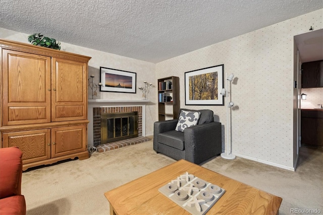 living room with a textured ceiling, light carpet, baseboards, a brick fireplace, and wallpapered walls