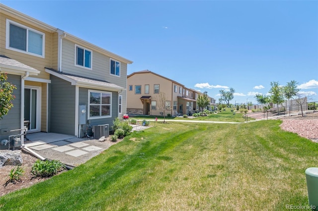 9719 Albion Ln, Thornton, CO 80229 - view of grassy yard with central AC