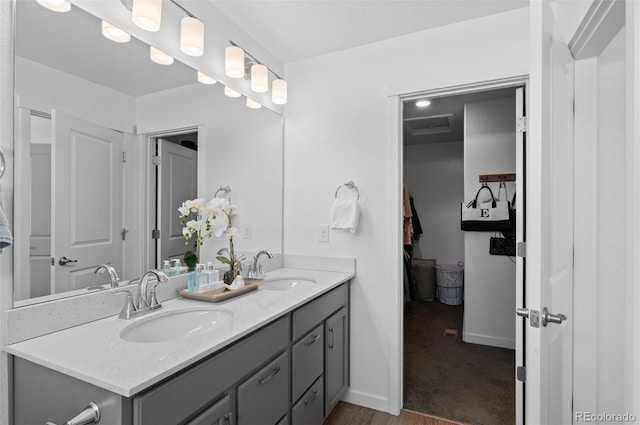 9719 Albion Ln, Thornton, CO 80229 - full bathroom featuring double vanity and baseboards