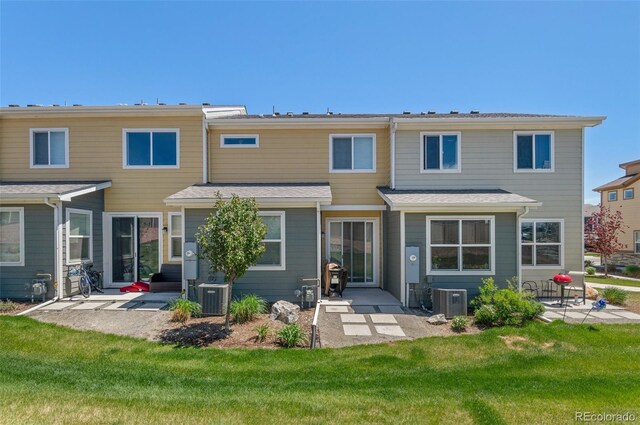 9719 Albion Ln, Thornton, CO 80229 - rear view of house featuring a patio, cooling unit, and a lawn