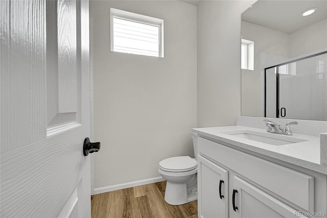 4644 Hatcher Dr, Brighton, CO 80601 - bathroom with vanity, wood finished floors, and a shower with door