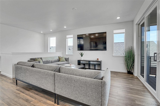 8728 Hotchkiss St, Littleton, CO 80125 - living room with wood finished floors, recessed lighting, and baseboards