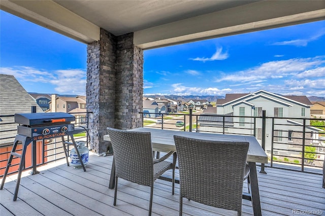 8728 Hotchkiss St, Littleton, CO 80125 - wooden deck featuring a residential view