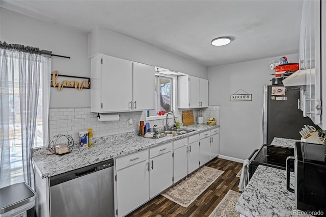 kitchen with stainless steel appliances, dark hardwood / wood-style floors, sink, and white cabinets